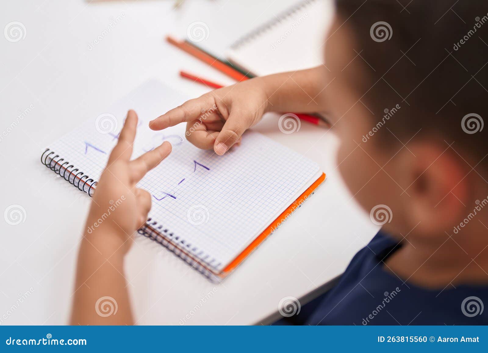 Adorable Hispanic Toddler Doing Mathematics Exercise Counting with