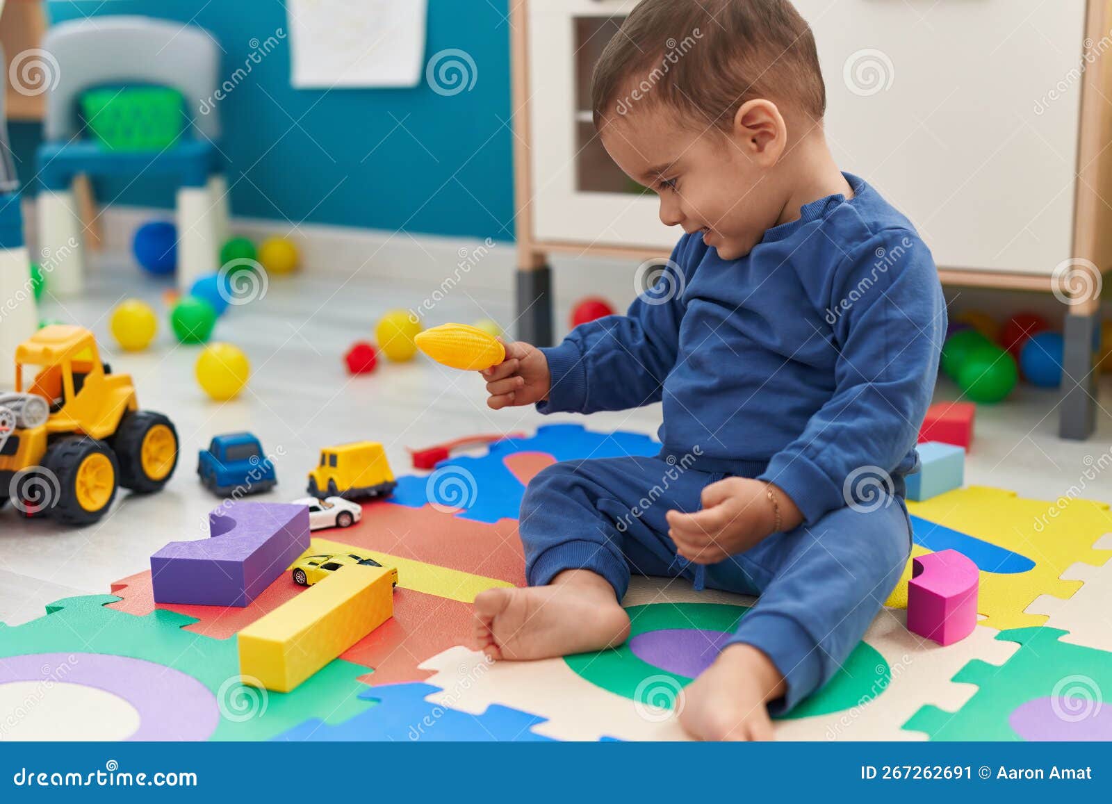 Adorable Hispanic Toddler Playing with Construction Blocks and Bubbles