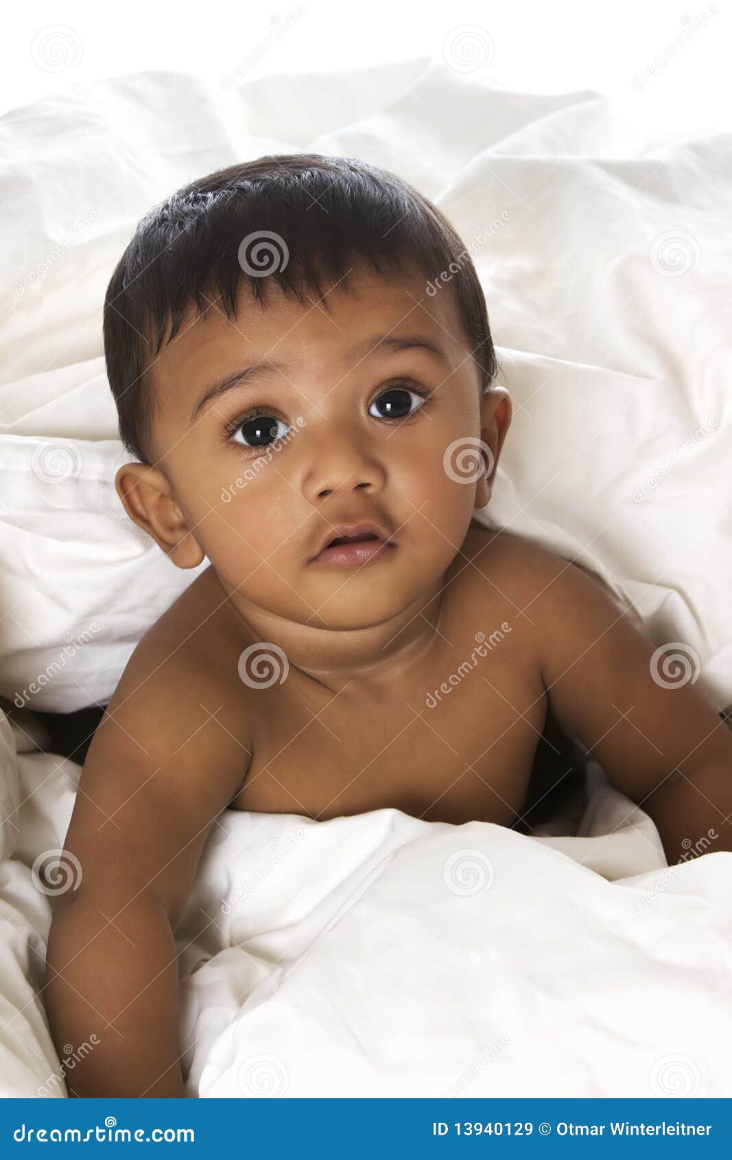 adorable indian baby lying on blanket