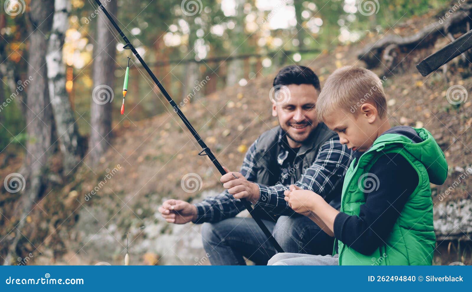 Adorable Little Boy is Fishing with Dad in Pond in Forest Holding Rod while  His Dad is Talking To Him Explaining How To Stock Photo - Image of  outdoors, care: 262494840