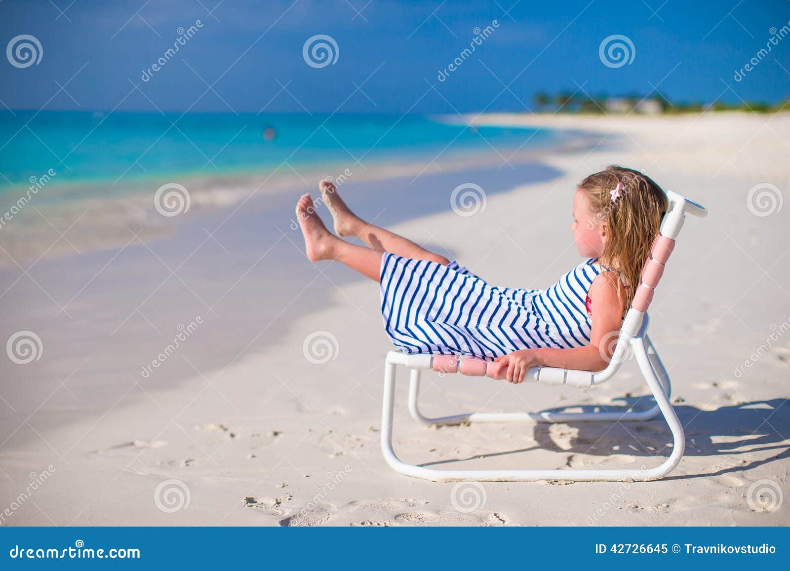 Adorable Little Girl On Beach Chair During Summer Stock Image