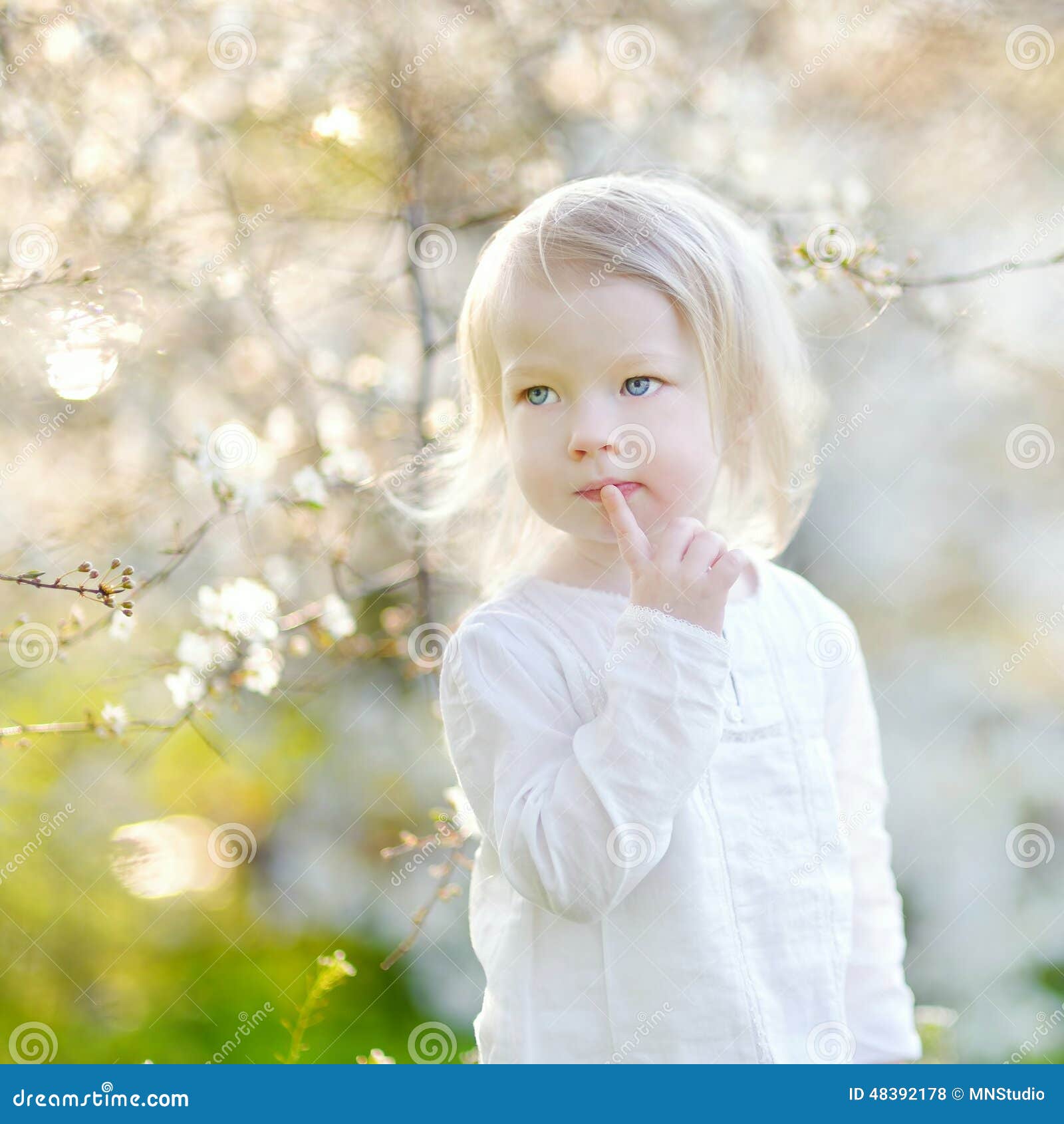 Adorable Little Girl In Blooming Cherry Garden Stock Photo - Image ...