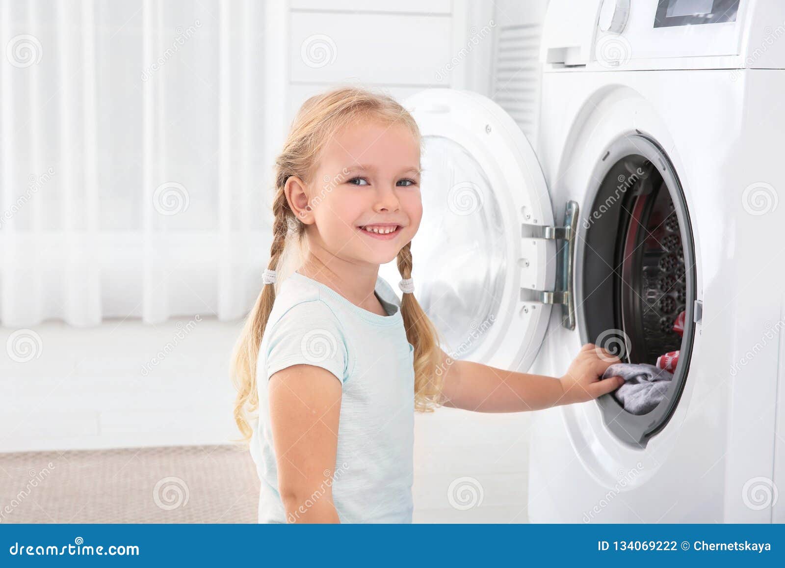 Adorable Little Girl Doing Laundry at Home Stock Photo Image of