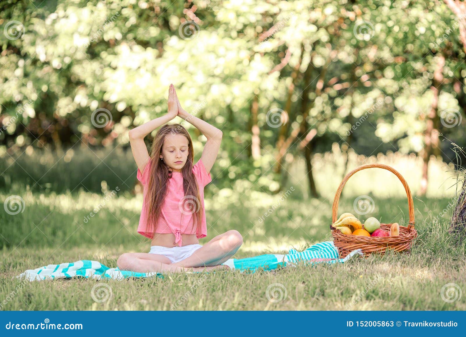 Little Girl in Yoga Position in the Park. Stock Image - Image of