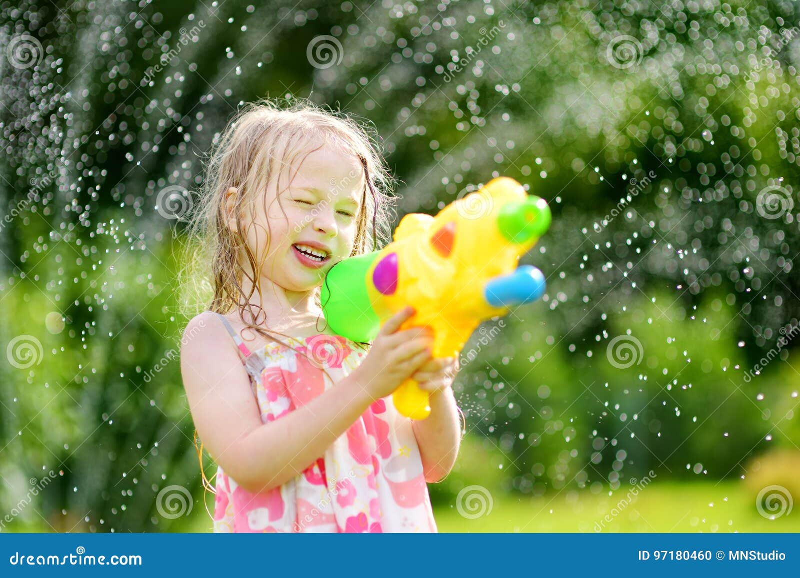 Adorable Little Girl Playing with Water Gun on Hot Summer Day. Cute Child  Having Fun with Water Outdoors Stock Photo - Image of leisure, beautiful:  97180460