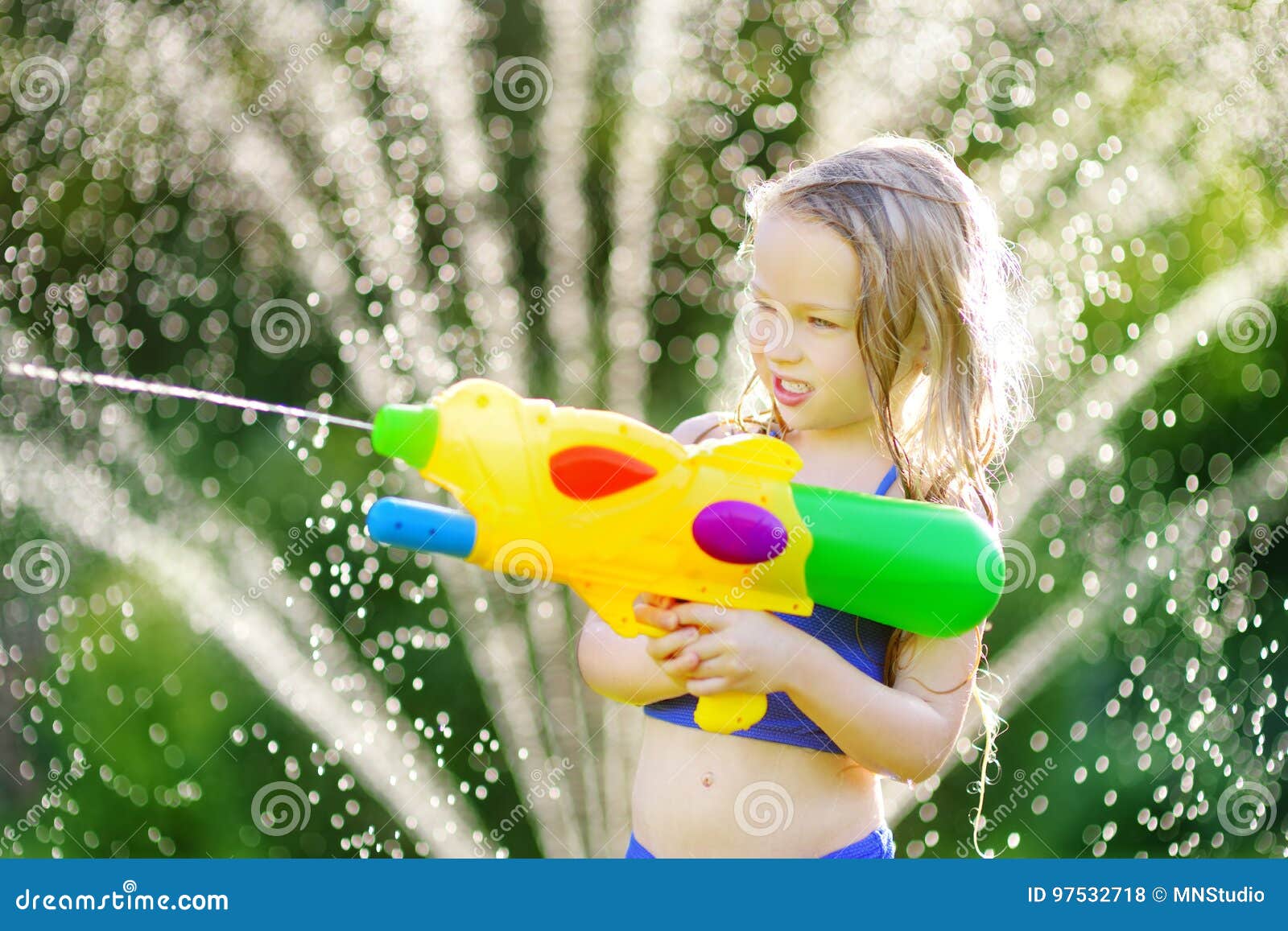 Adorable Little Girl Playing with Water Gun on Hot Summer Day. Cute Child  Having Fun with Water Outdoors Stock Photo - Image of leisure, beautiful:  97180460