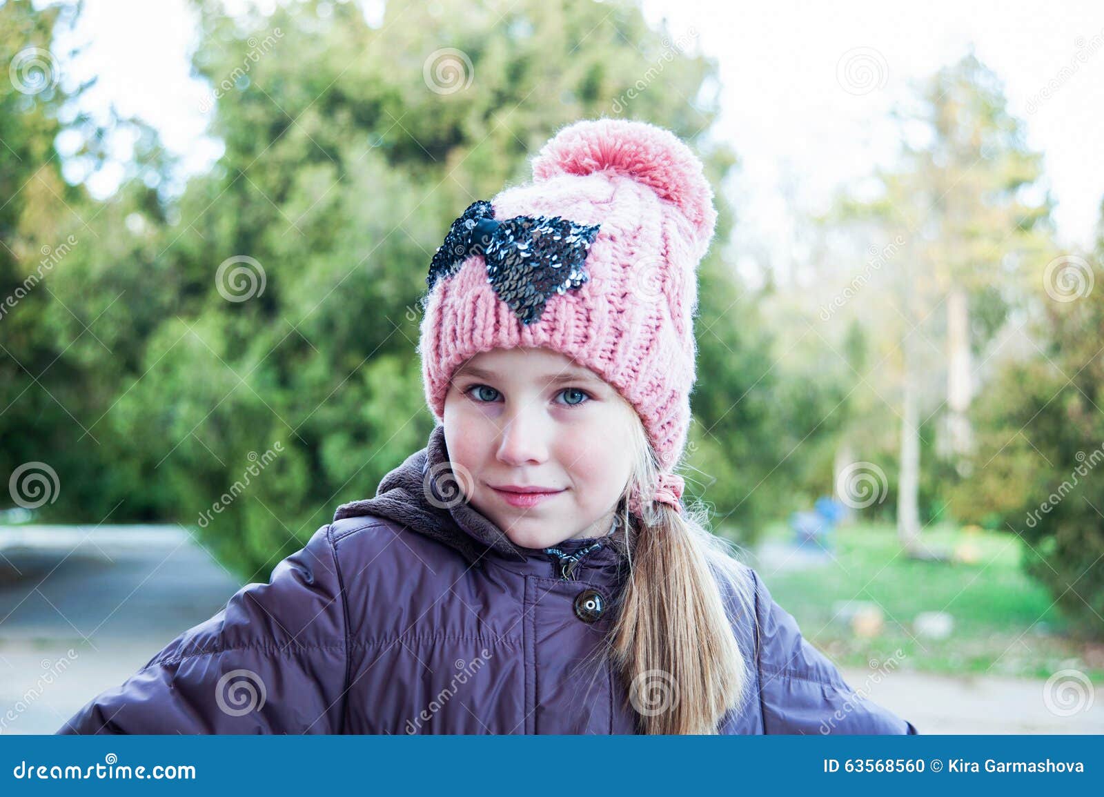Adorable Little Girl Posing. Wearing Winter Coat And Hat. Stock Photo ...