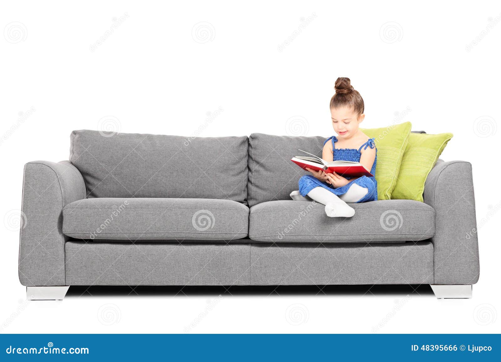 Reading Book On Sofa Adorable Reading A Book On Sofa Stock Photo