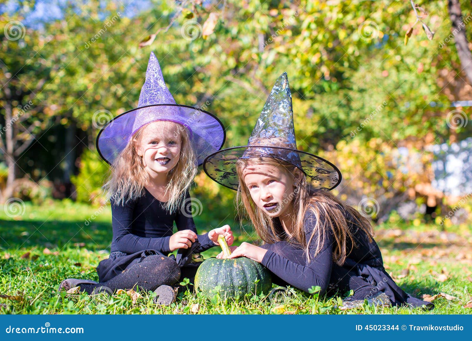 Adorable Little Girls in Witch Costume Casting a Stock Photo - Image of ...