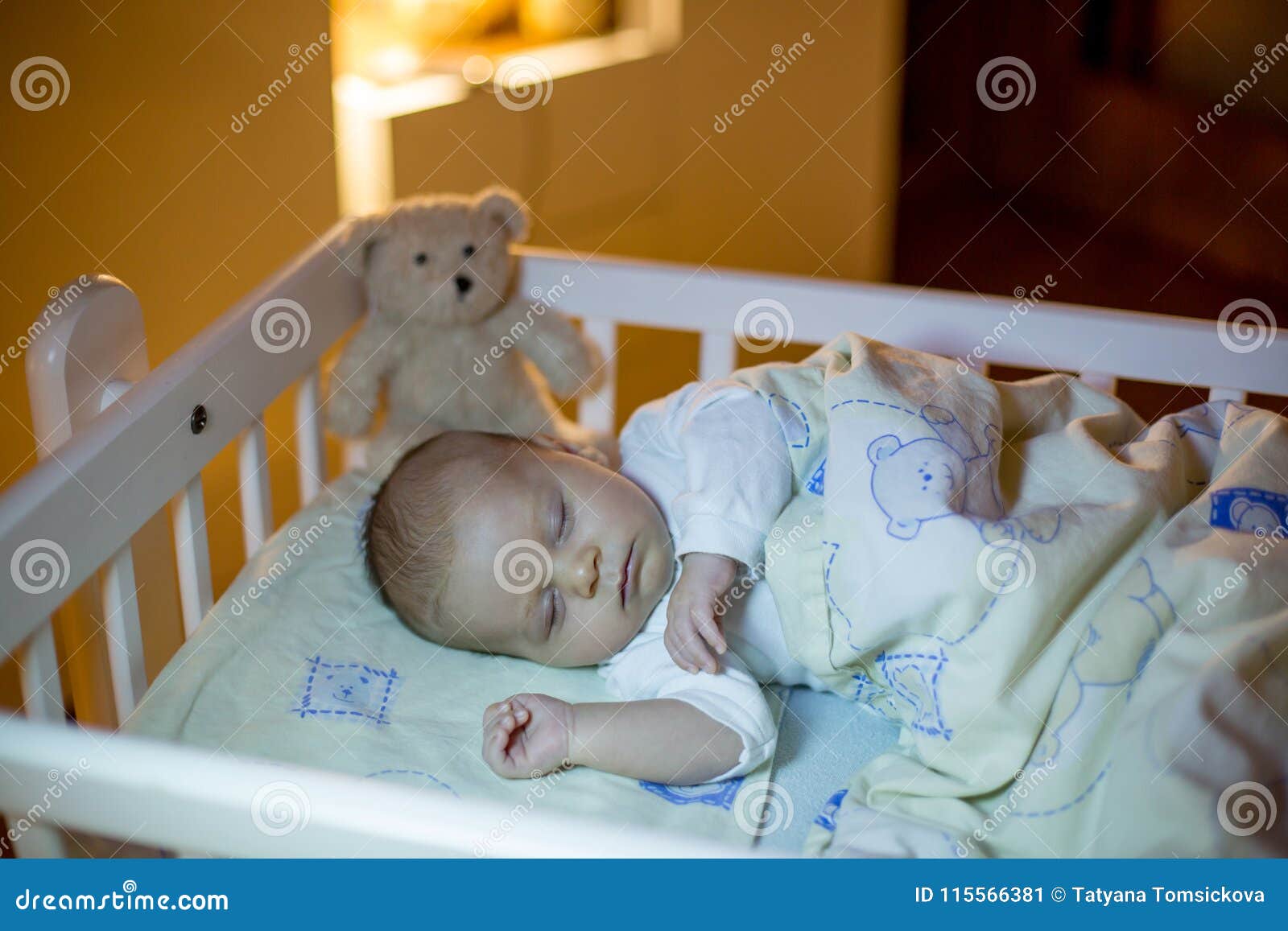 newborn sleeping in crib