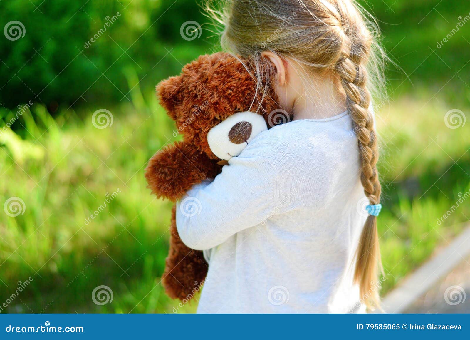 Girl Hugging Teddy Bear