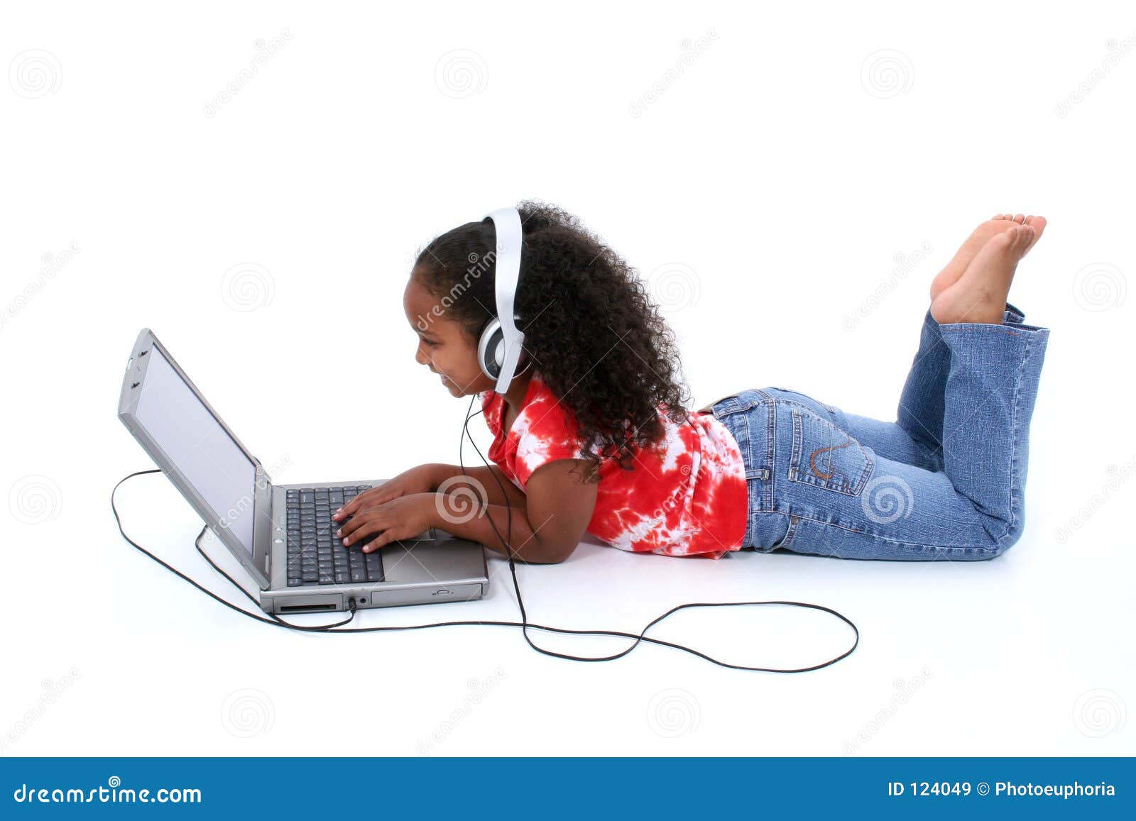 adorable six year old girl sitting on floor with laptop computer