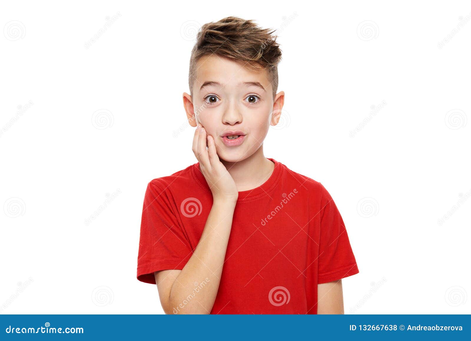 adorable young boy in shock,  over white background. shocked child looking at camera in disbelief.