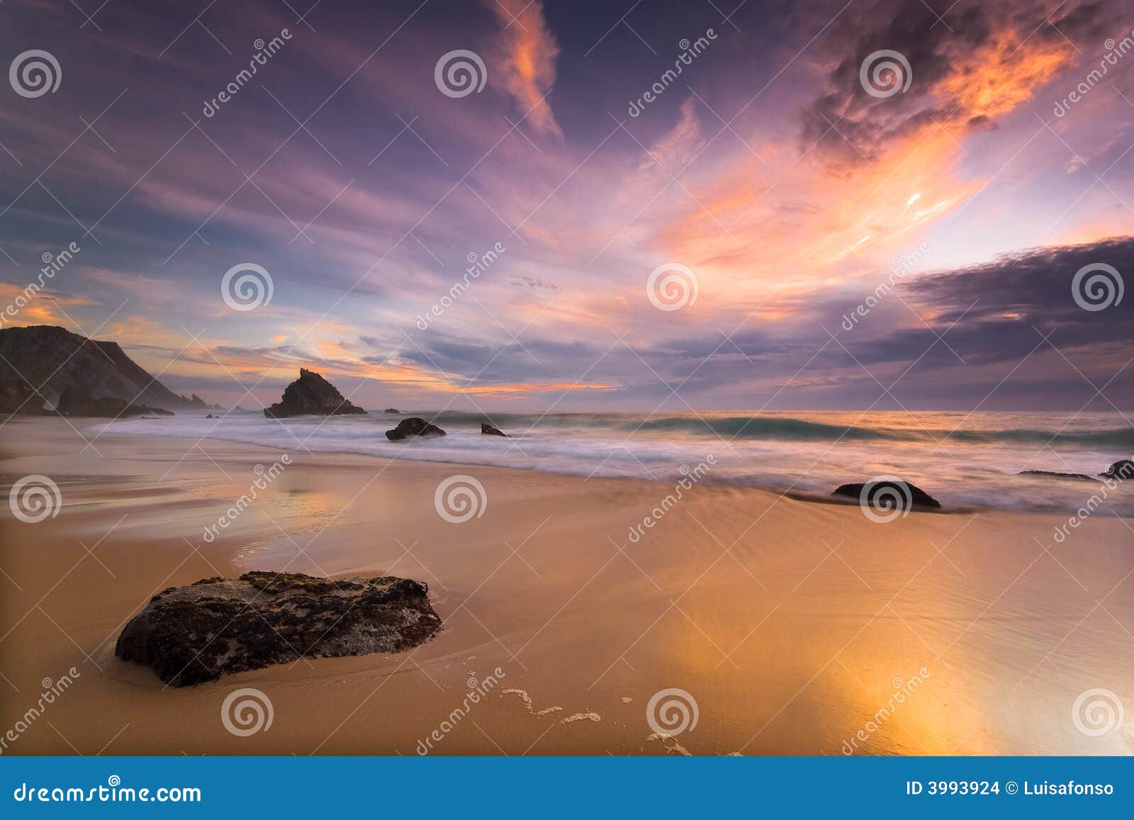 adraga beach at sunset