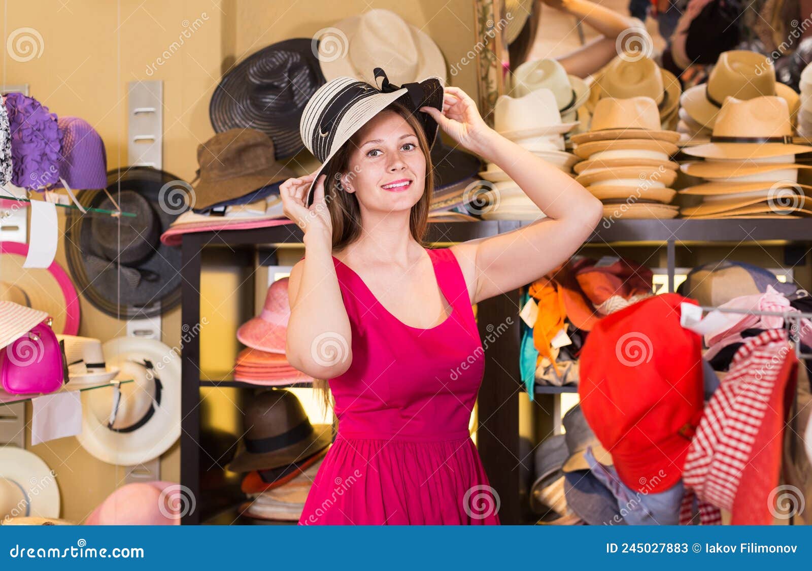 Adult Woman Try on Hatinator Hat in Shopping Mall Stock Image - Image ...