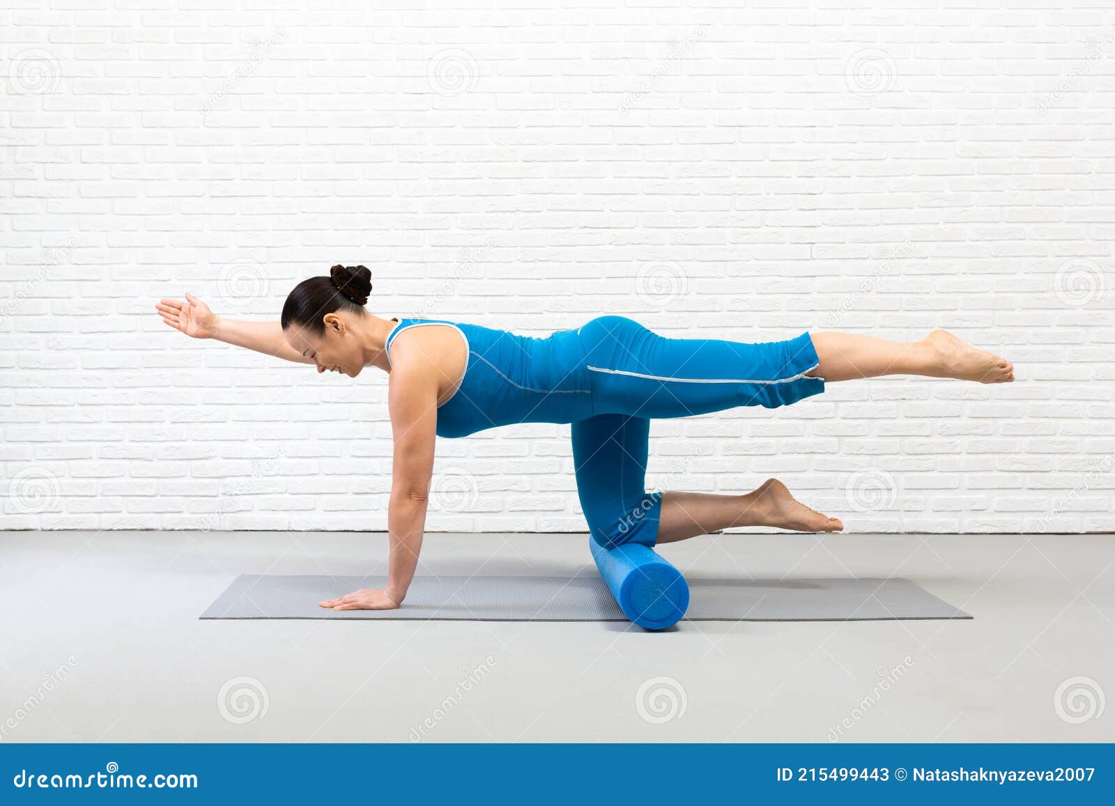 Adult Fit Woman Practice Pilates with Props in Fitness Studio Indoor, Bird  Dog Drill with One Leg Up and Foam Roller Stock Image - Image of activity,  caucasian: 215499443