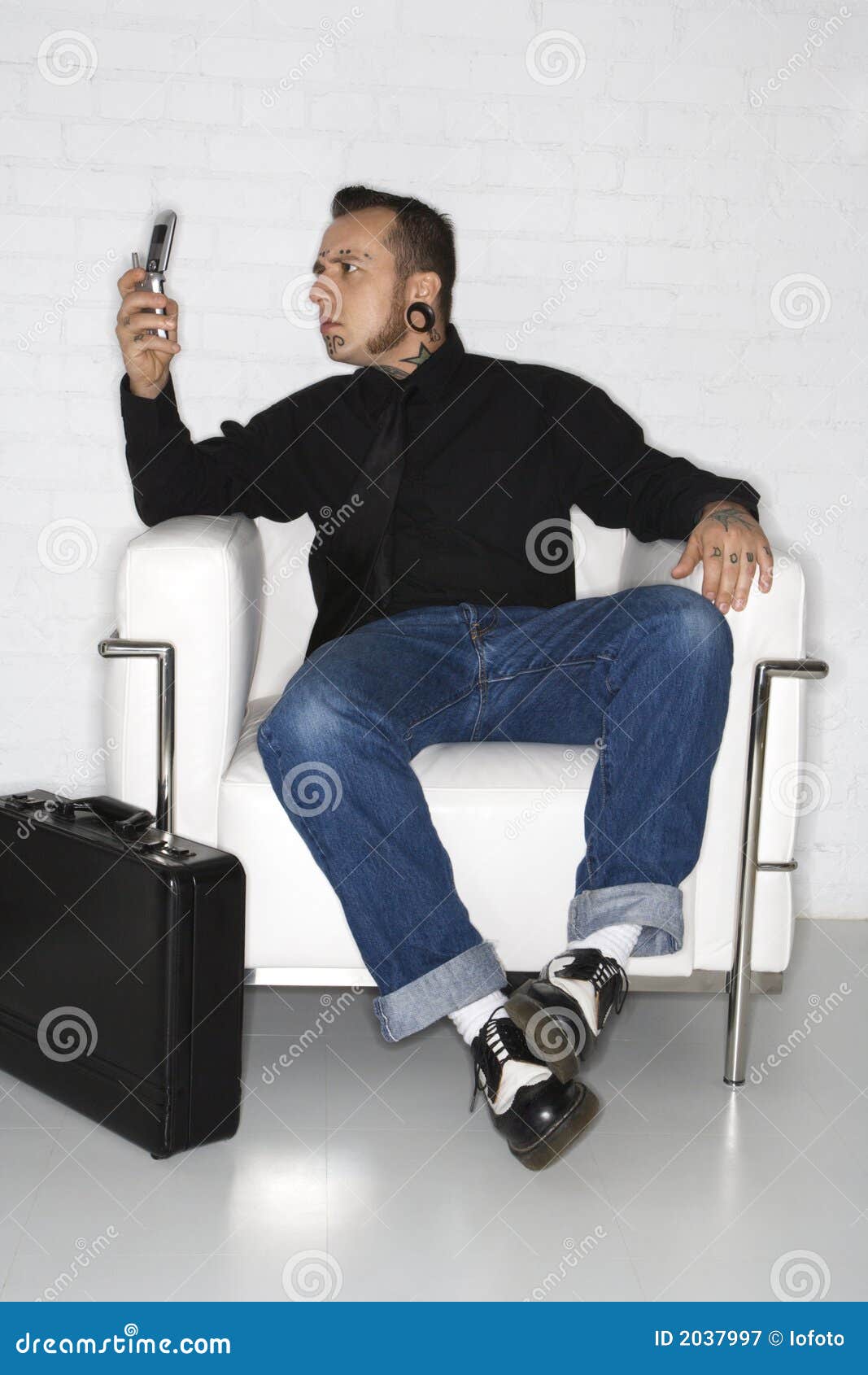 Adult Male Looking at Cell Phone with Briefcase. Stock Image Image of