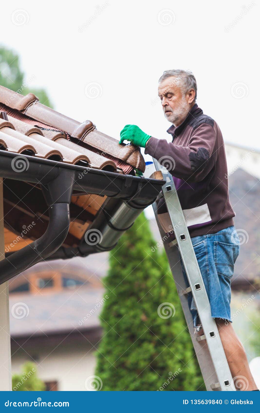 Man Repairs Tiled Roof Of House Close Up Stock Photo Image of glove, protection 135639840
