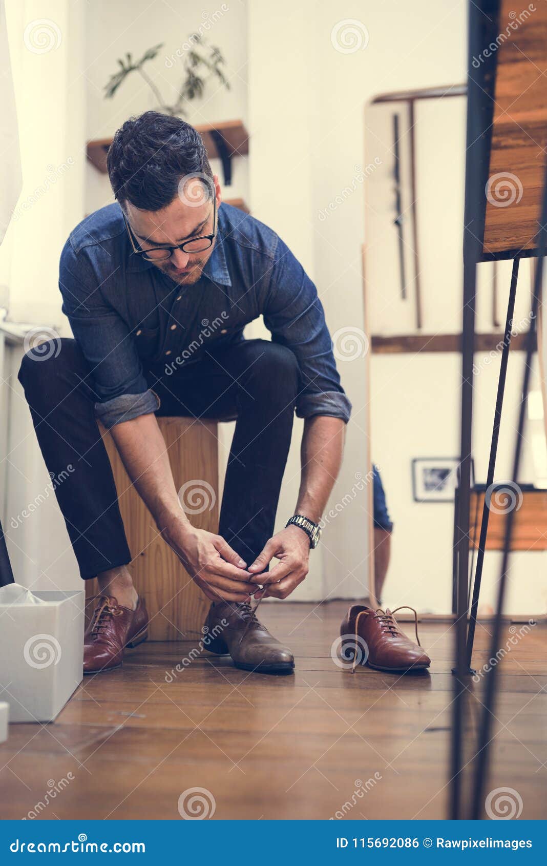 tying his shoelaces