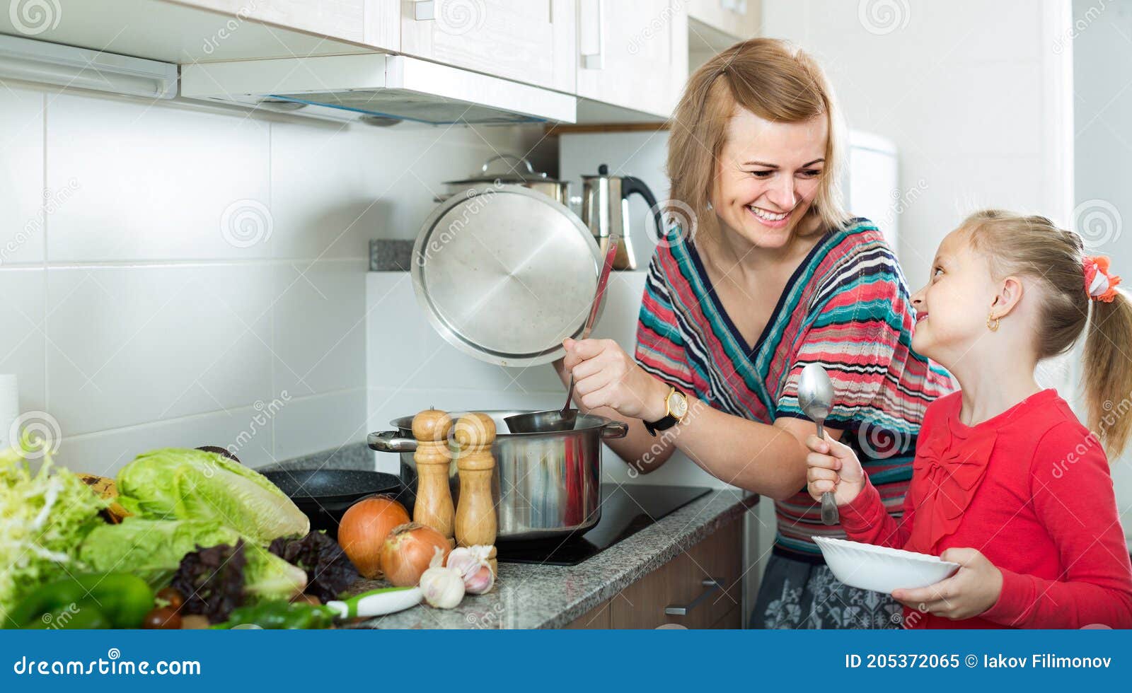 Mother And Little Daughter Tasting Soup Together Stock Image Image Of Kitchen Little 205372065 