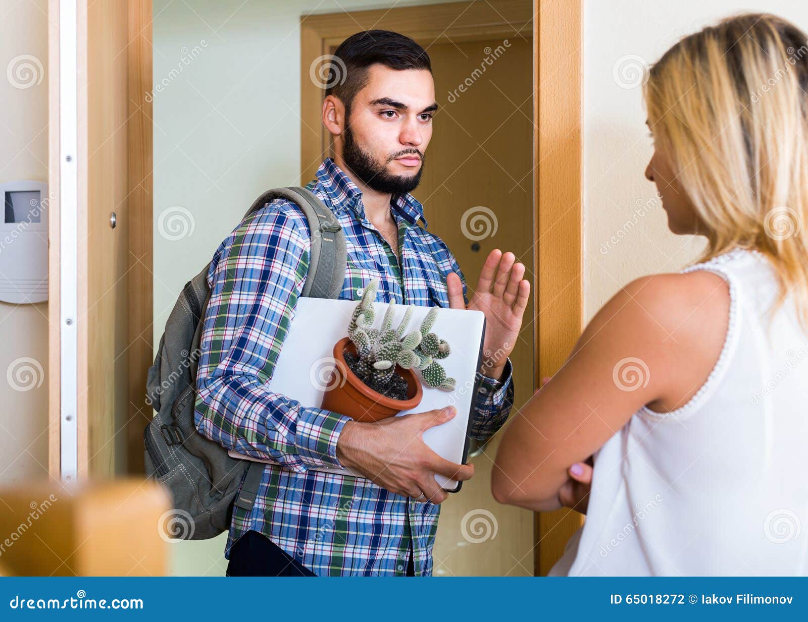 Adult Watching How Spouse Moving Out with Baggage Stock Photo Image