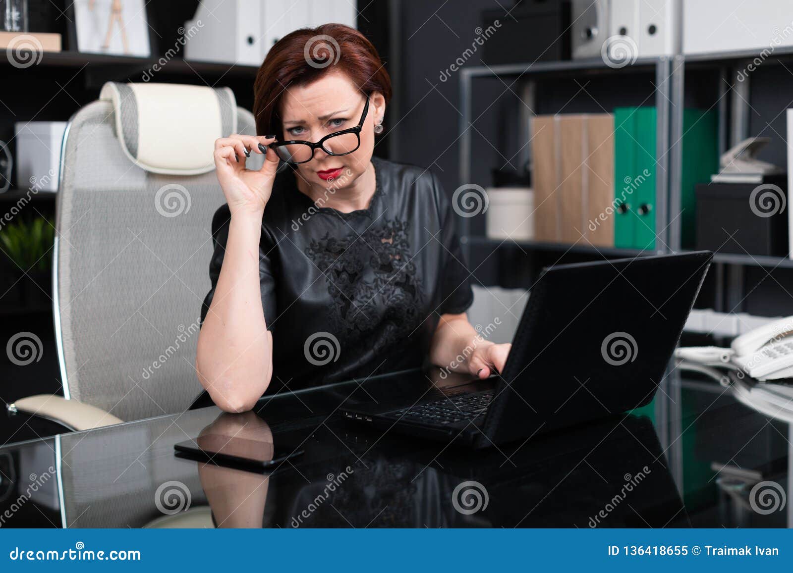 Stylish Woman Lifted Her Glasses And Looks Right Sitting At Table In