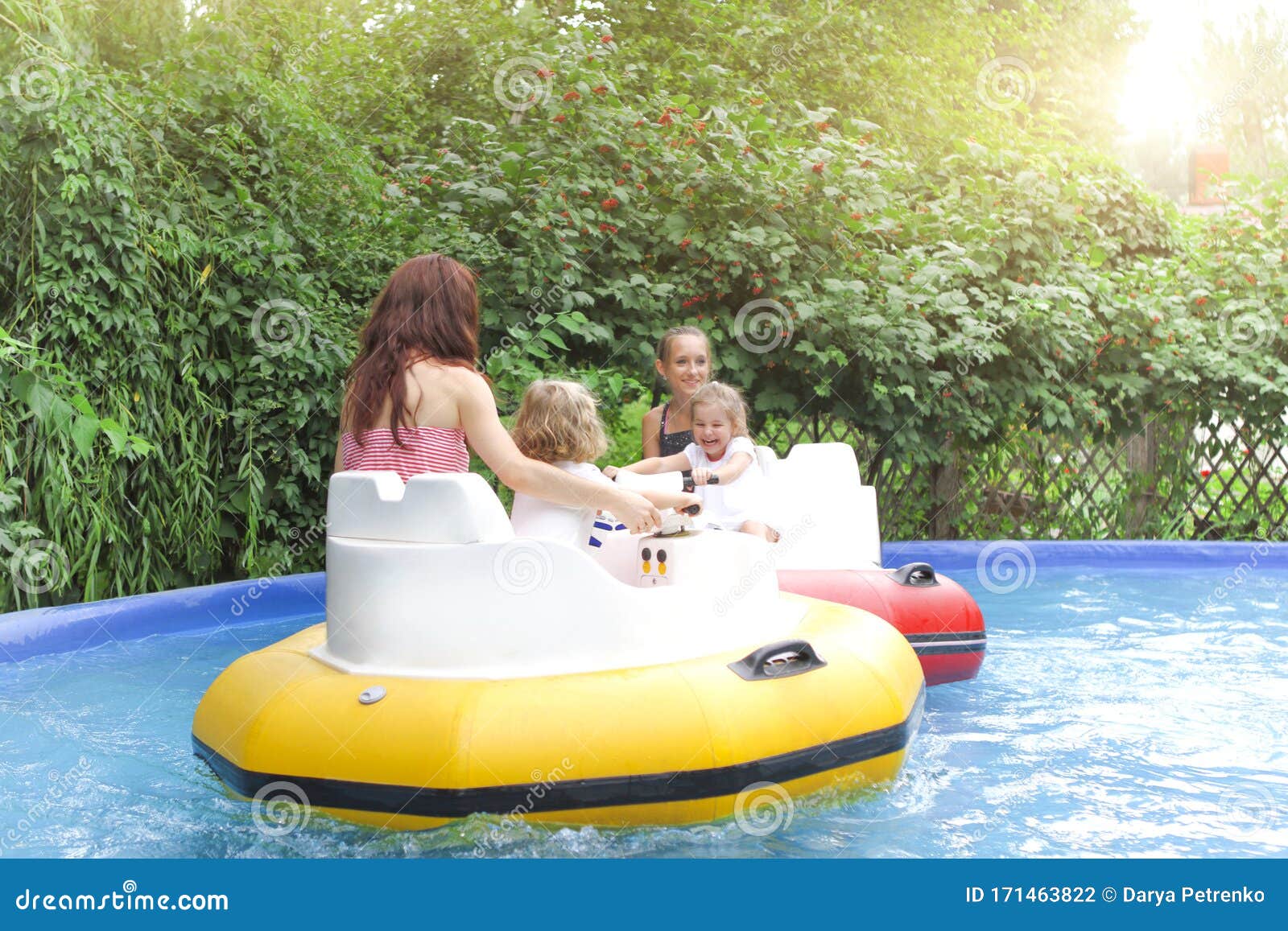 Mother With Kids Riding Bumper Boats Stock Photo - Image ...