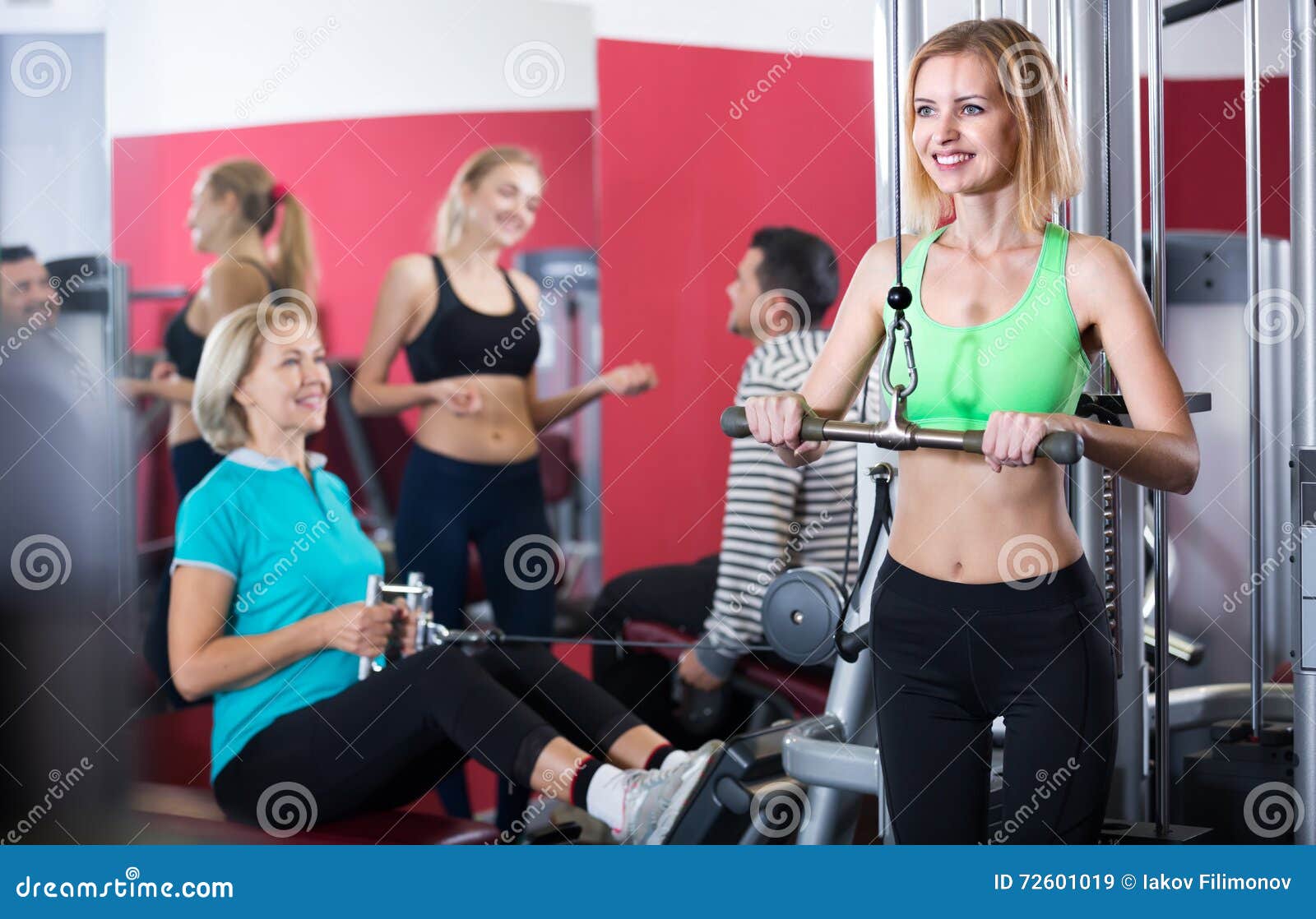 Adults working out in gym stock image. Image of hobby - 72601019