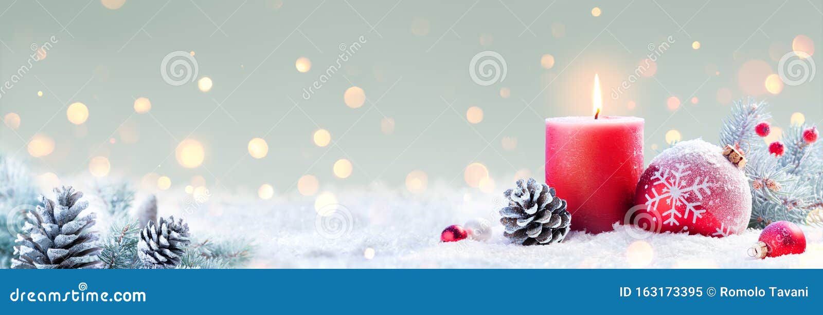 advent - red candle and christmas decoration
