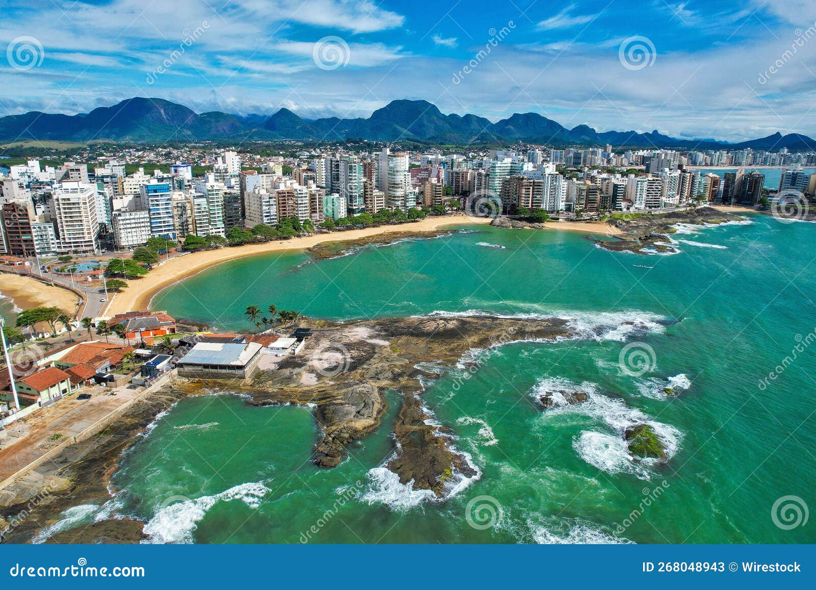 aerial of the areia preta beach in guarapari town in brazil with alongside the blue calm ocean