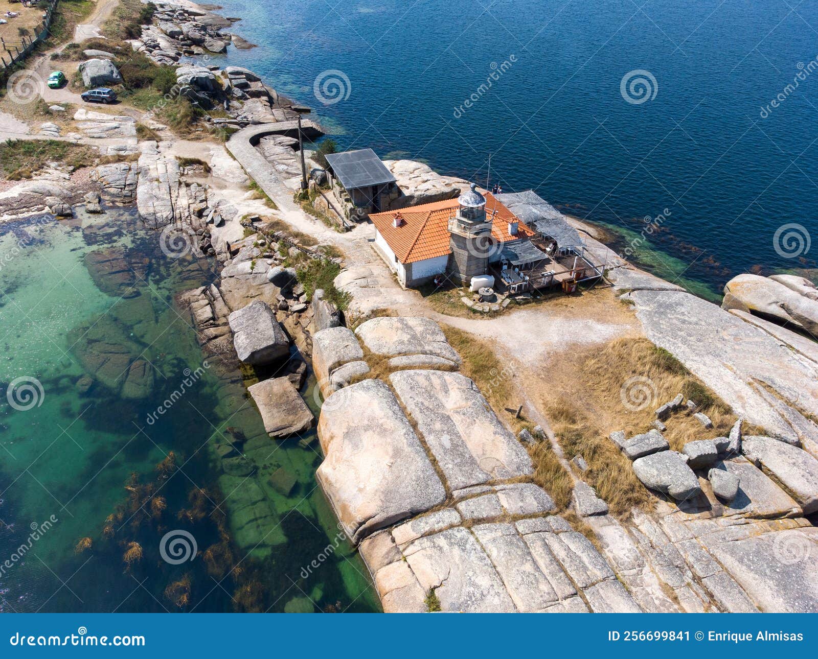 aerial dron view of punta cabalo lighthouse in arousa island, spain.