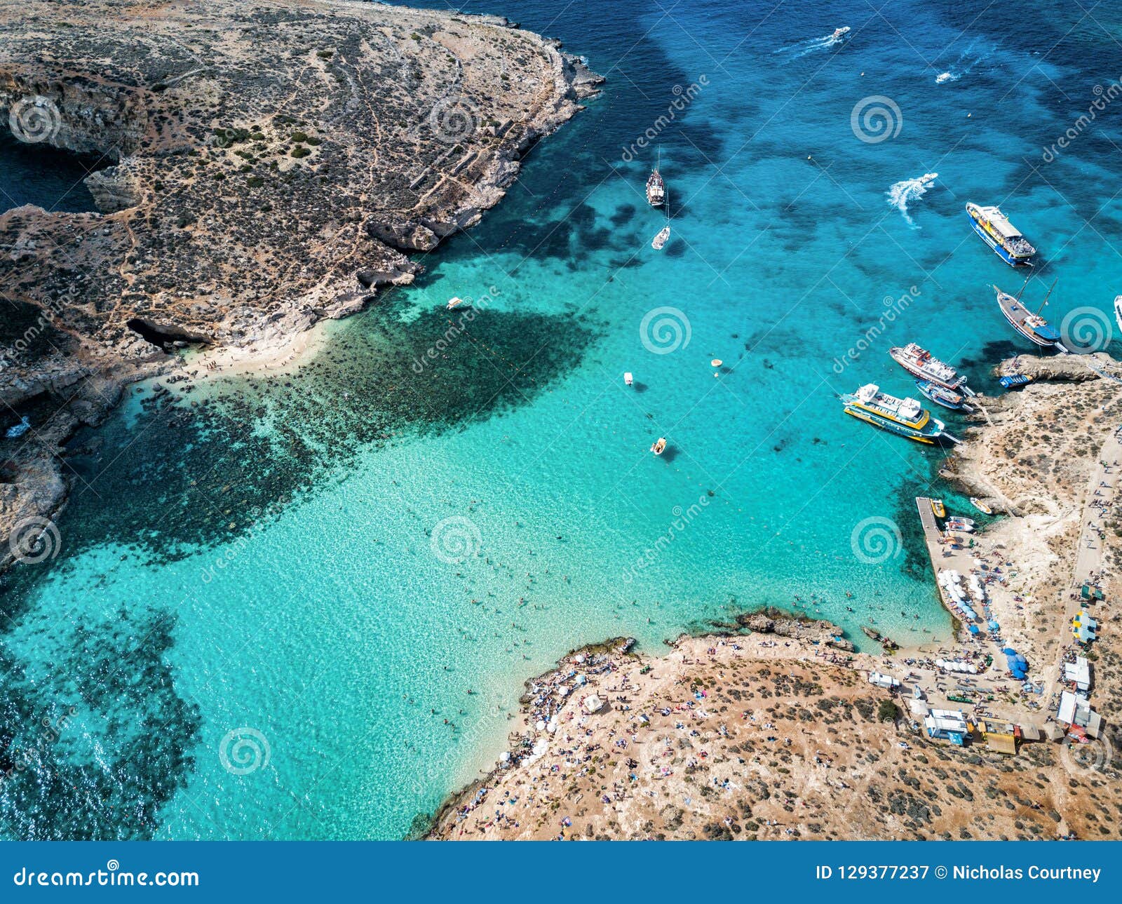 drone photo - the beautiful blue lagoon of comino island. malta