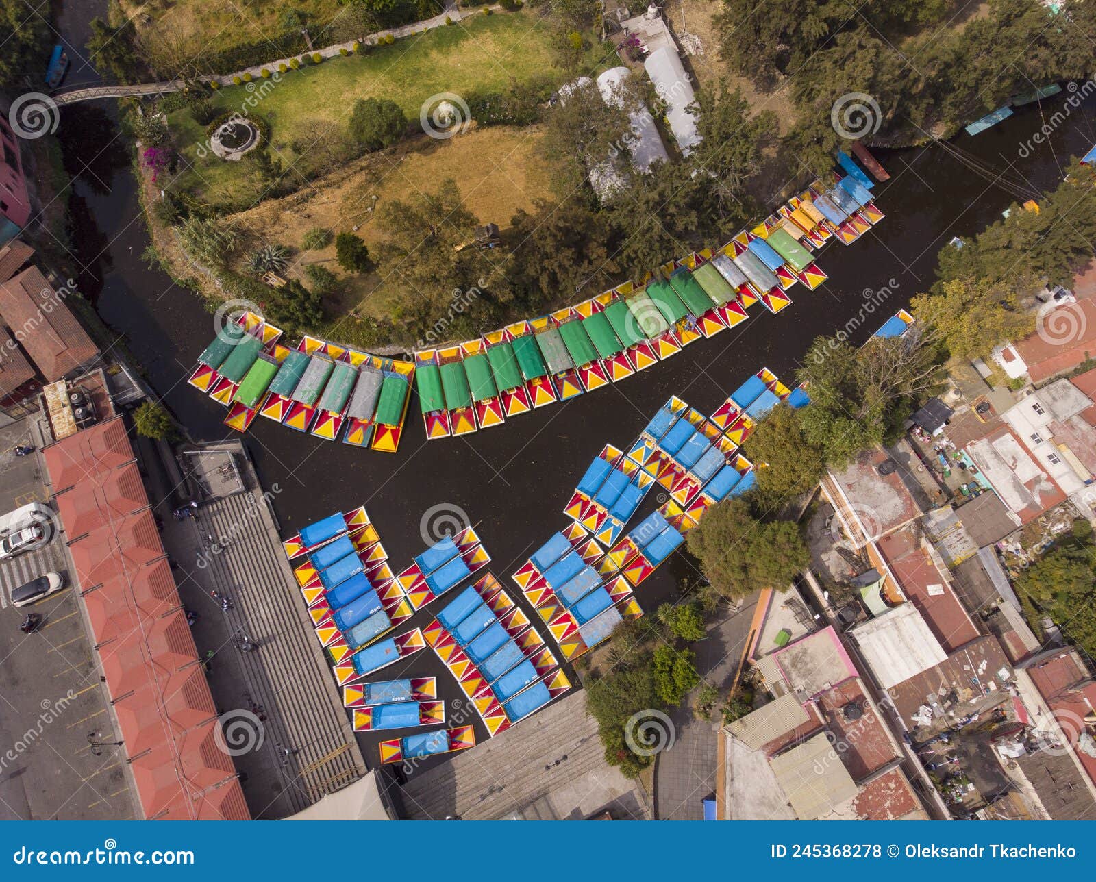 aerial drone shot of colorful boats in xochimilco. tours by cannels with floating gardens in mexico city cdmx, mexico