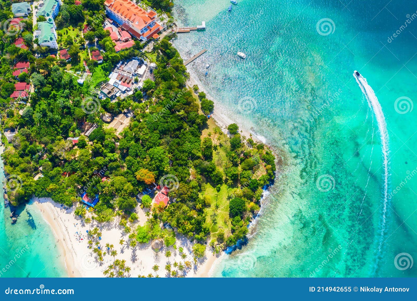 aerial drone view of beautiful caribbean tropical island cayo levantado beach with palms and boat. bacardi island, samana,