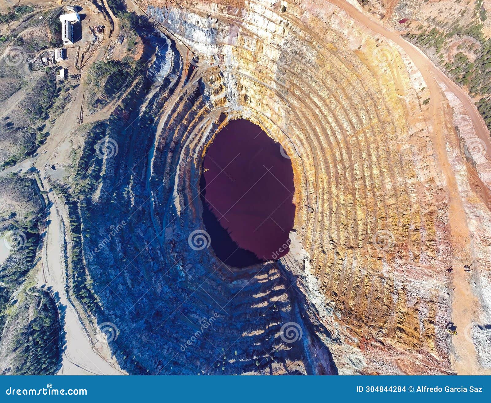 aerial drone view of corta atalaya with mining levels at open mine pit.