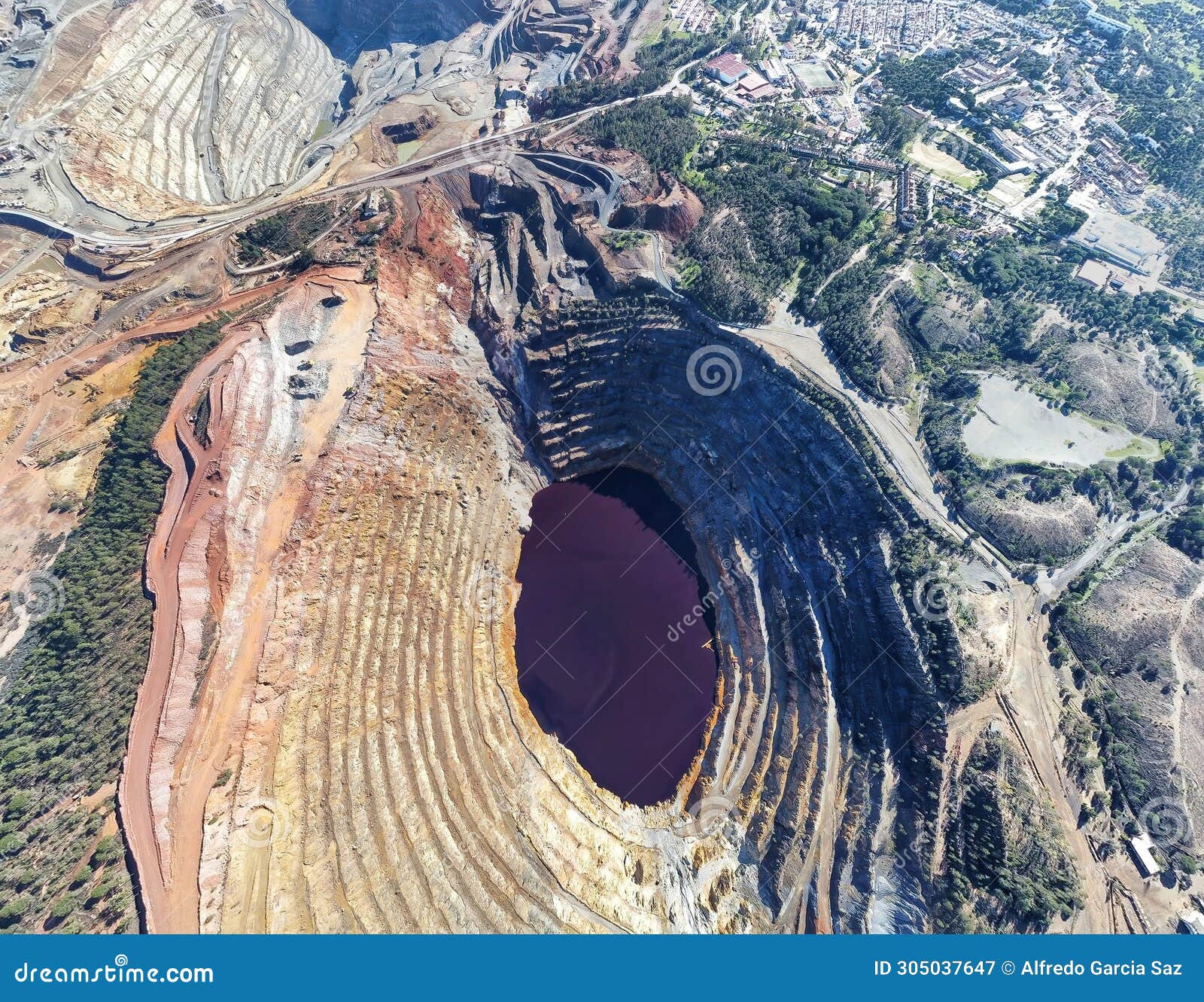 aerial drone view of corta atalaya with mining levels at open mine pit.
