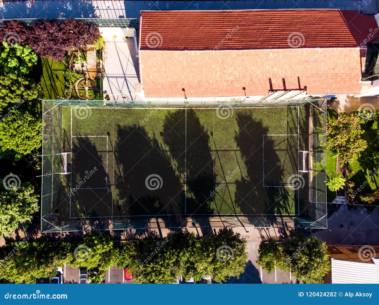 aerial drone view of football field in garden with trees at istanbul moda.