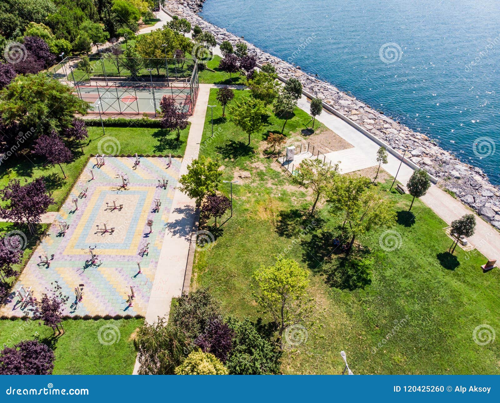 aerial drone view of kadikoy moda seaside with public exercise equipment and basketball court in istanbul.