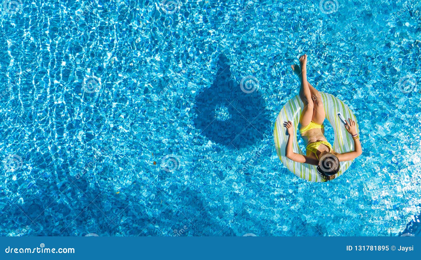 Aerial Drone View of Little Girl in Swimming Pool from Above, Kid Swims ...