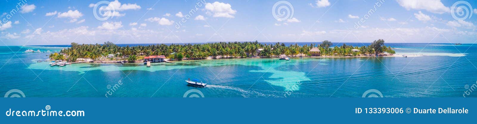 aerial drone view of south water caye tropical island in belize barrier reef