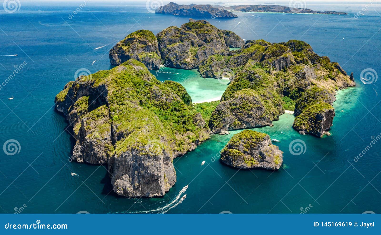 aerial drone view of tropical ko phi phi island, beaches and boats in blue clear andaman sea water from above, thailand