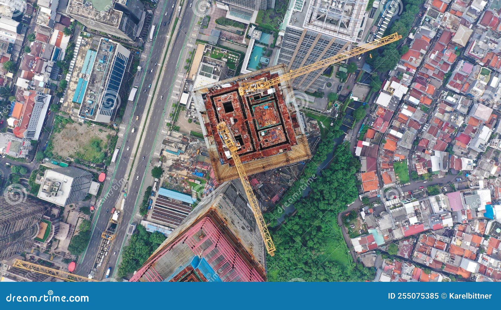 Aerial Flight Over a New Constructions Development Site with High Tower