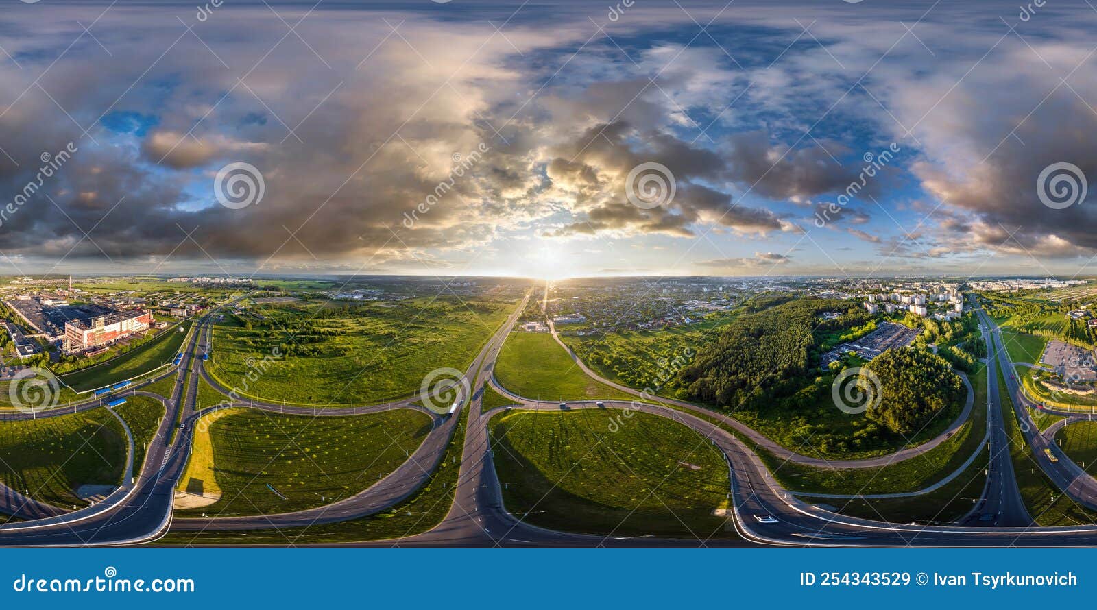 aerial full spherical seamless hdr 360 panorama over huge road junction of freeway at height of 100 meters at susnset in