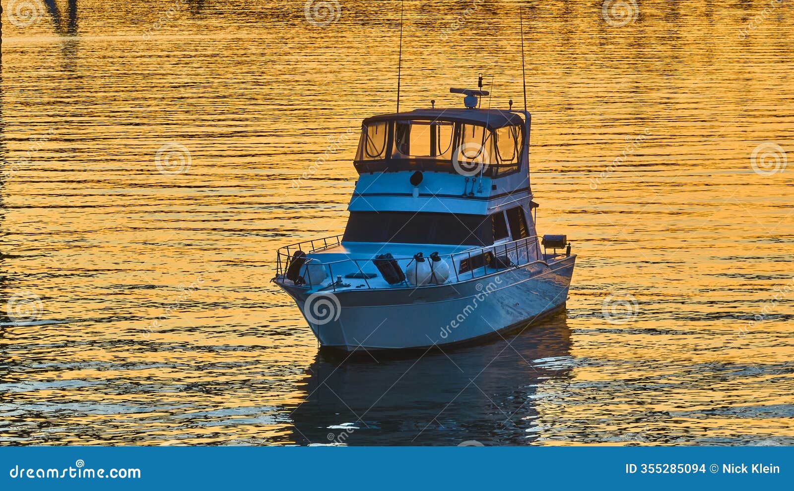 aerial golden hour yacht on ohio river with skyline reflections