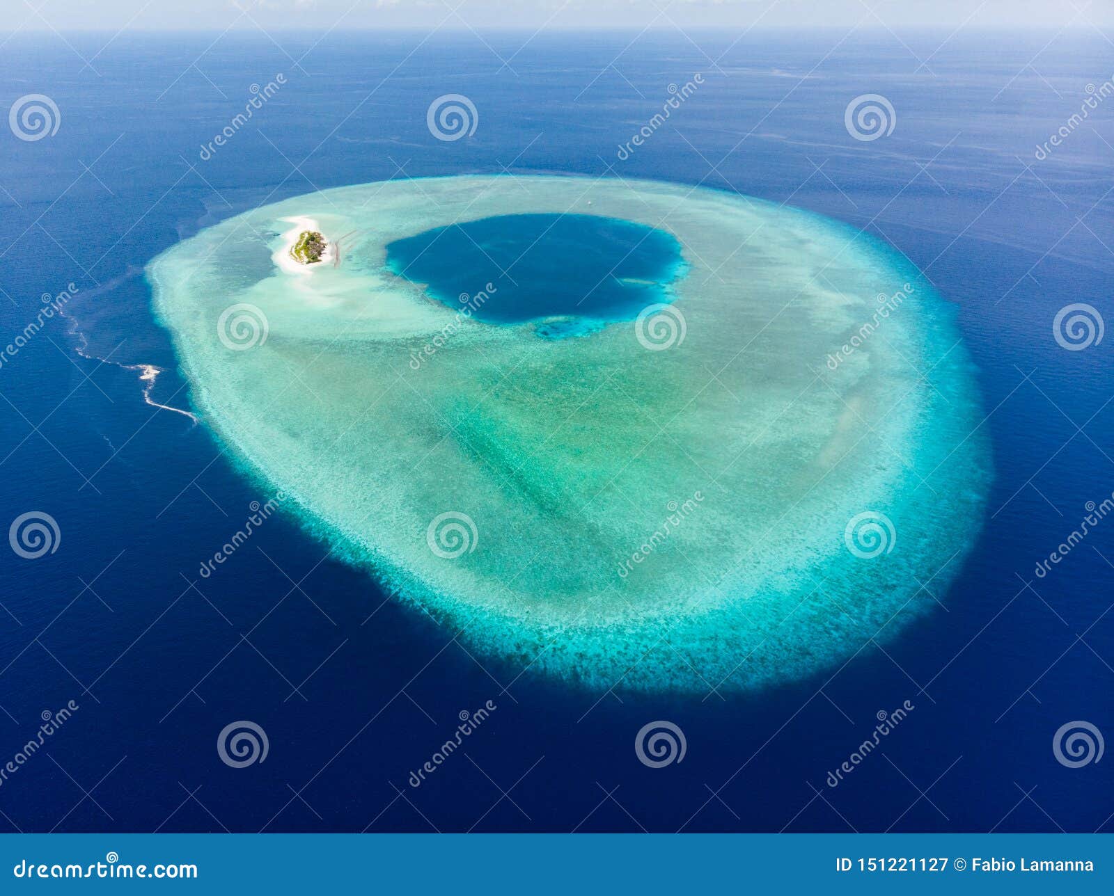 aerial idyllic atoll, scenic travel destination maldives polinesia. blue lagoon and turquoise coral reef. shot in wakatobi