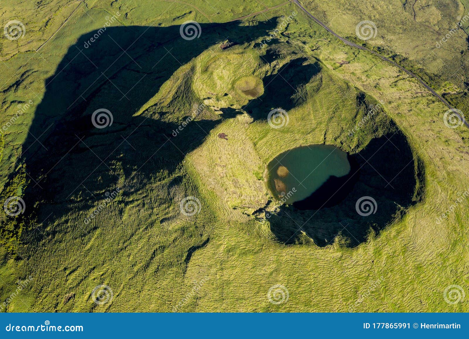aerial image of typical green volcanic caldera crater landscape with volcano cones of planalto da achada central plateau of ilha