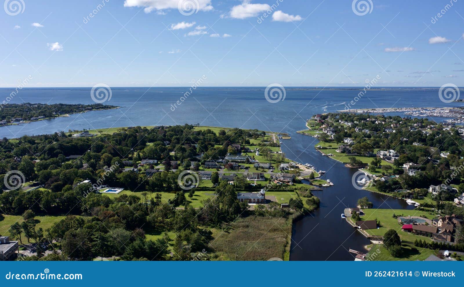 aerial landscape shot over bay shore, long island, new york, the us on a sunny day
