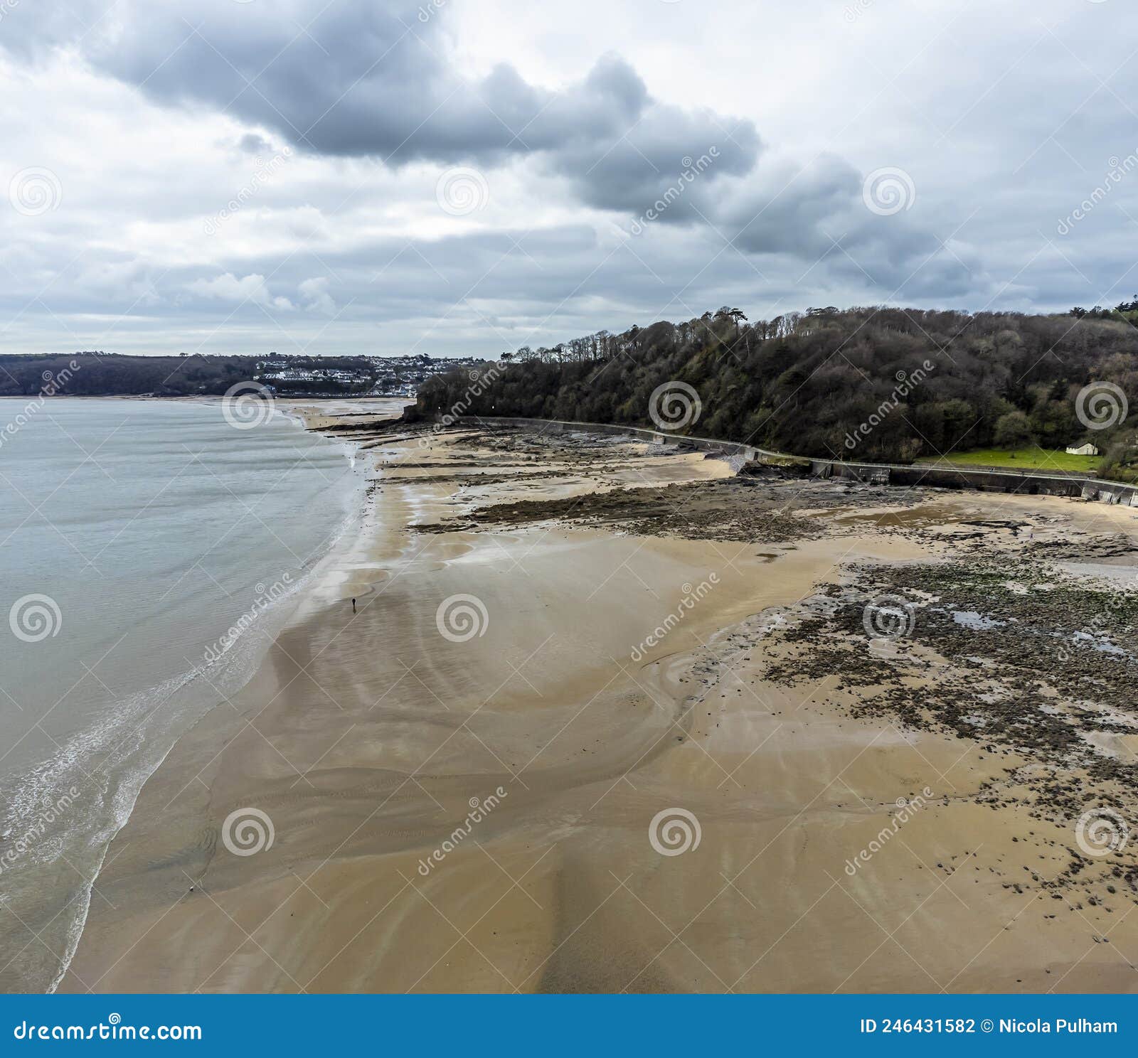 an aerial panorama view west along the beach at wisemans bridge in pembrokeshire, south wales