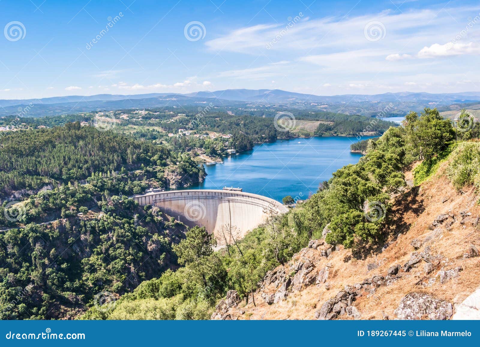 aerial and panoramic view over the cabril dam and the zÃÂªzere river with degraded mountains in the background, pedrogÃÂ£o pequeno -