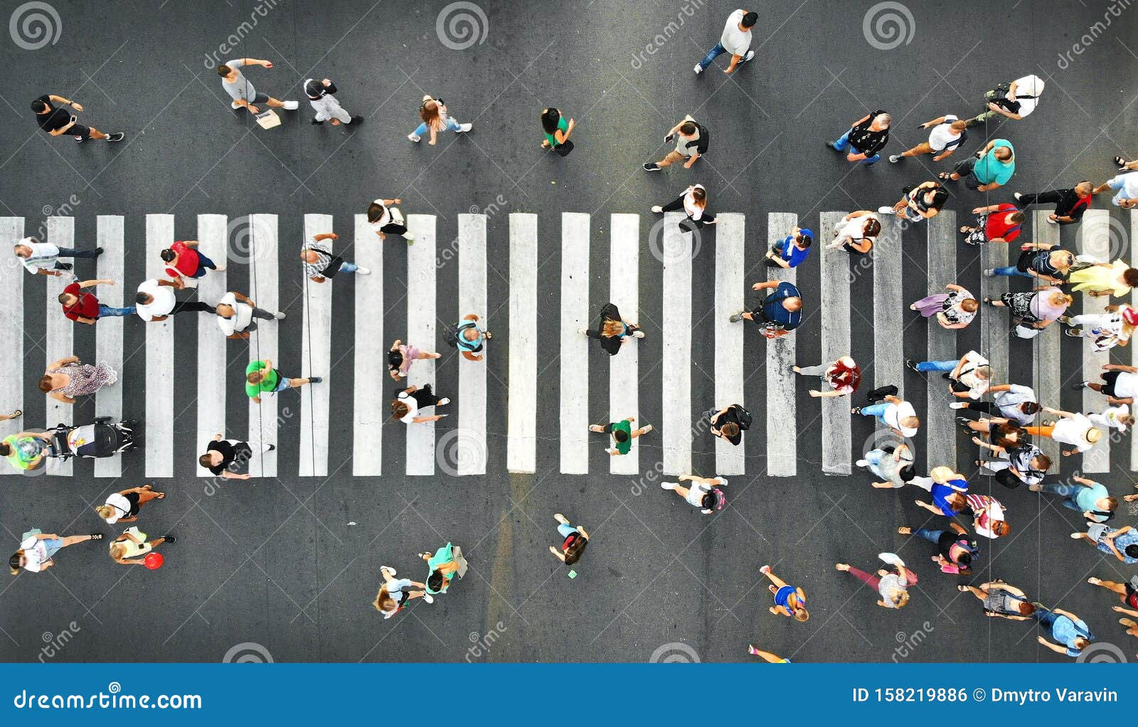 aerial. people crowd motion on pedestrian crosswalk. top view